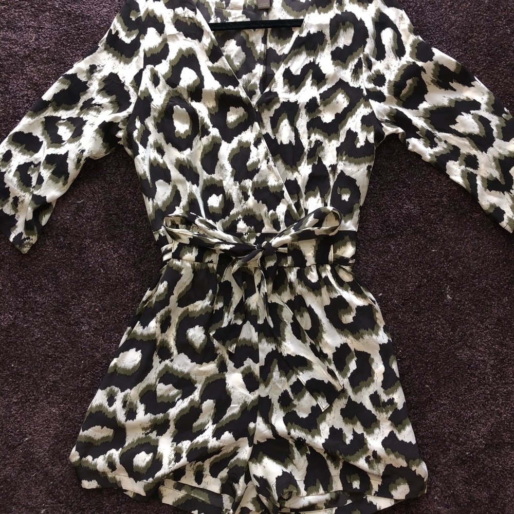 Green and black cheetah (camo looking) romper.